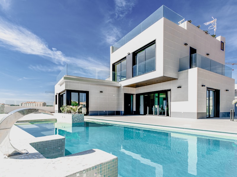 Professional window cleaner cleaning residential windows with eco-friendly products in Garland TX